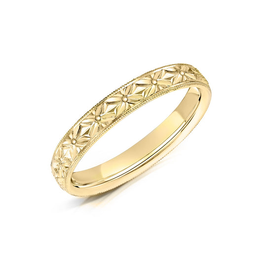 Yellow Gold Wedding ring with hand engraved floral pattern.