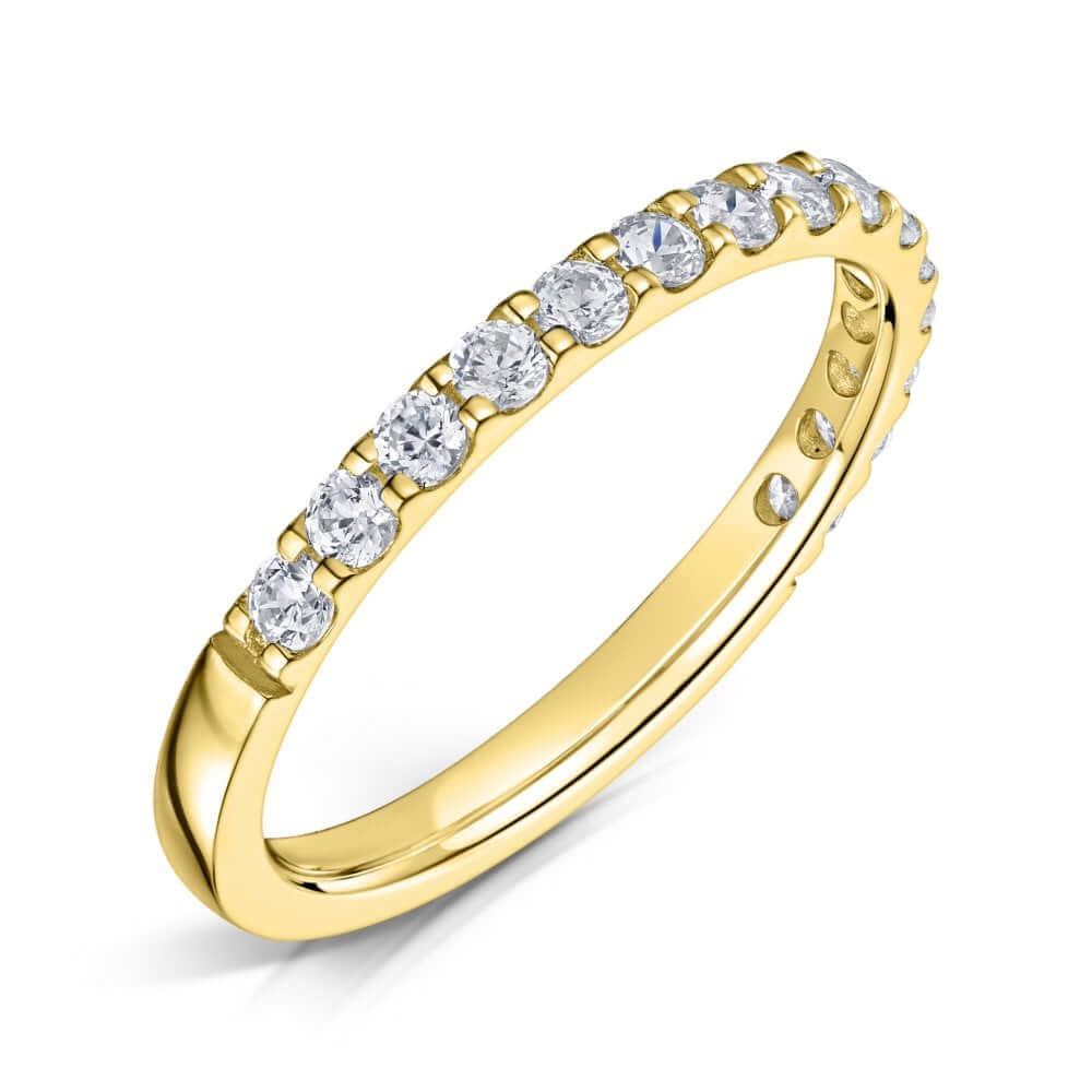 2.0mm Yellow gold eternity ring with round diamonds set half the way around on a white background.