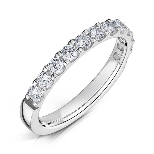 2.5mm wide platinum ring with round diamonds set half way around in a claw setting on a white background.
