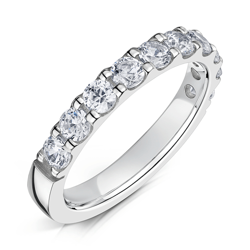 3.0mm wide platinum ring with round diamonds set half way around in a claw setting on a white background.
