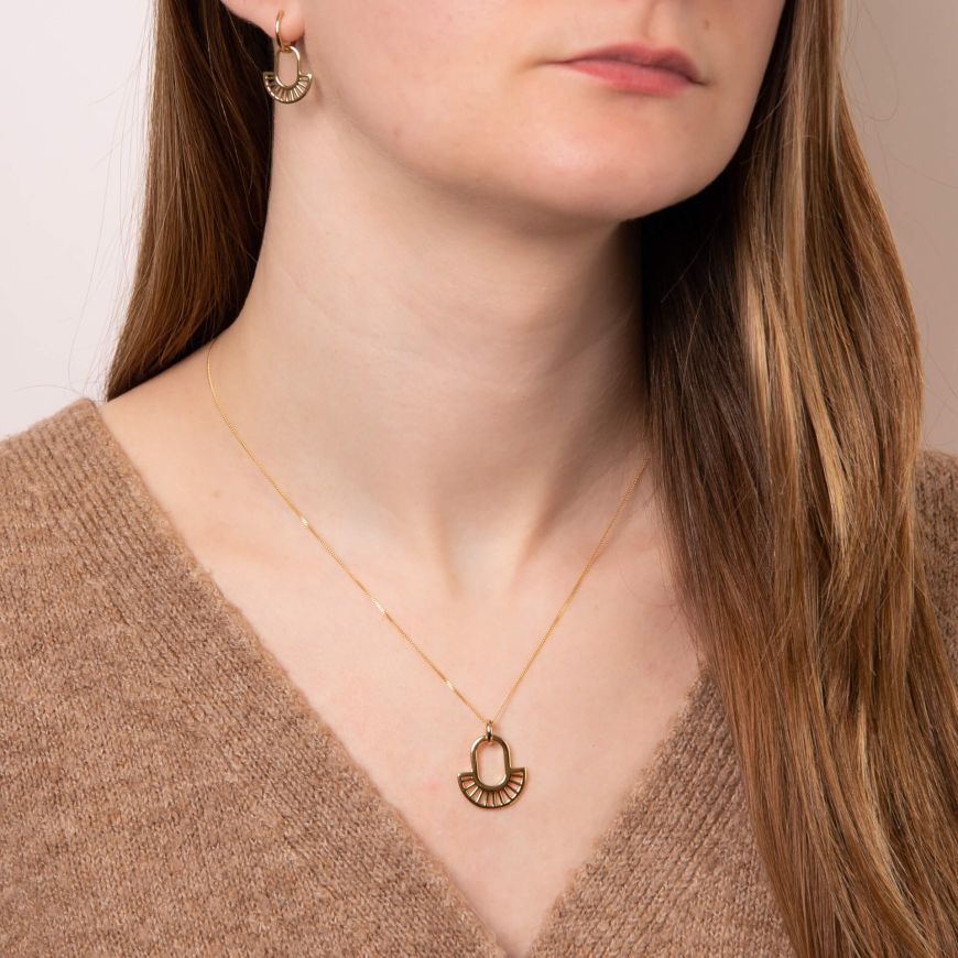 Yellow Gold Art Deco Style Earrings and matching necklace on model.